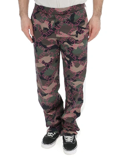 Shop Valentino Vltn Camouflage Pants In Multi