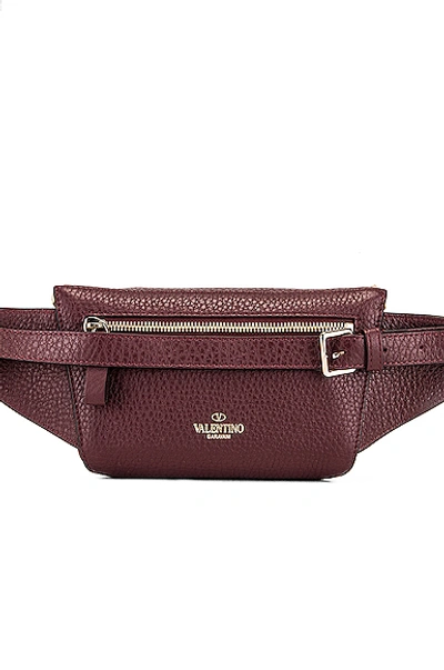 Shop Valentino Rockstud Belt Bag In Purple In Rubin
