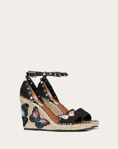 Shop Valentino Garavani Embroidered Butterfly Canvas Wedge Sandal 105 Mm In Black