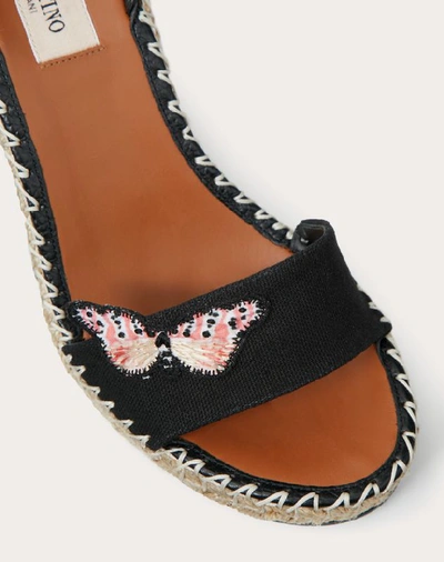 Shop Valentino Garavani Embroidered Butterfly Canvas Wedge Sandal 105 Mm In Black