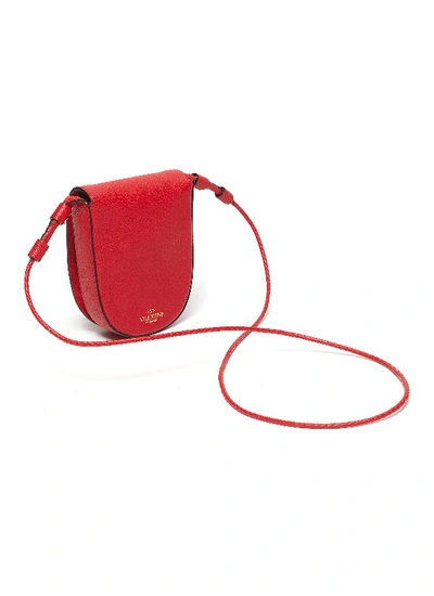 Shop Valentino Garavani 'vring' Tassel Small Leather Saddle Bag In Red