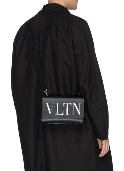 Shop Valentino Garavani 'vltn' Logo Print Leather Convertible Belt Bag