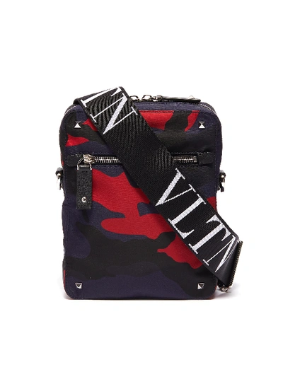 Shop Valentino 'vltn' Logo Shoulder Strap Camouflage Print Crossbody Bag In Dark Blue