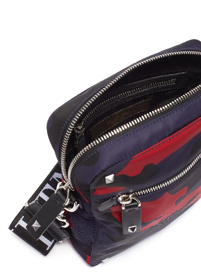 Shop Valentino 'vltn' Logo Shoulder Strap Camouflage Print Crossbody Bag In Dark Blue