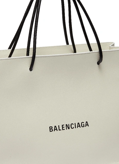 Shop Balenciaga 'east-west' Logo Print Medium Leather Shopping Tote Bag In White