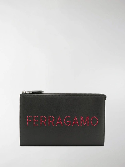 Shop Ferragamo Logo Studded Clutch Bag In Black