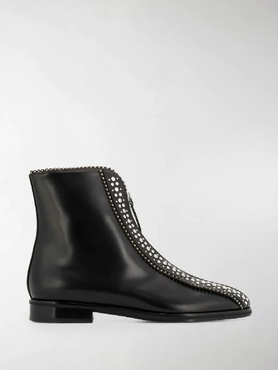 Shop Alaïa Studded Zip Ankle Boots In Black