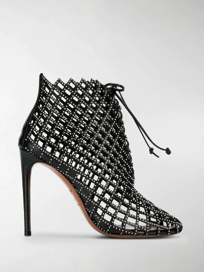 Shop Alaïa Laser Cut Ankle Boots In Black