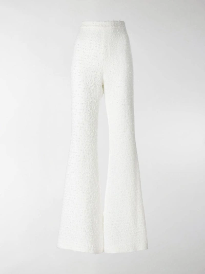 Shop Balmain Bouclé Tweed Flared Trousers In White