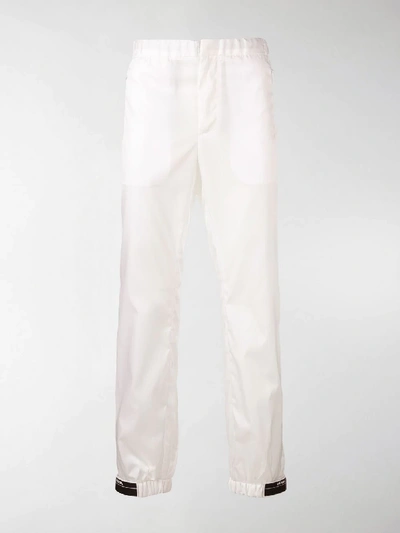 Shop Prada Tapered Elasticated Trousers In White