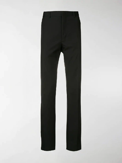 Shop Fendi Side Striped Trousers In Black