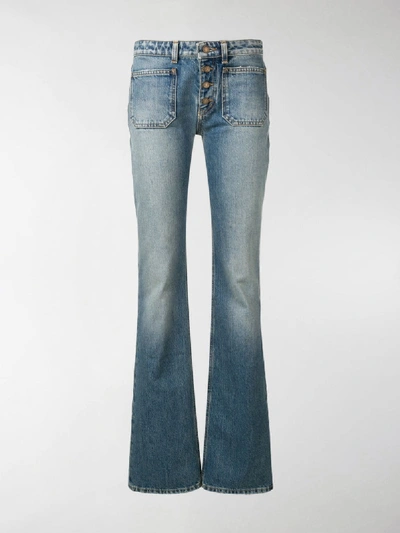 Shop Saint Laurent Button Up Flared Jeans In Blue