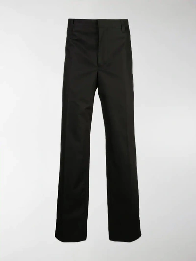 Shop Burberry Contrast Side Print Trousers In Black
