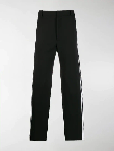 Shop Balenciaga Side Striped Trousers In Black
