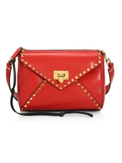 Shop Valentino Garavani Medium Rockstud Hype Leather Shoulder Bag In Deep Red