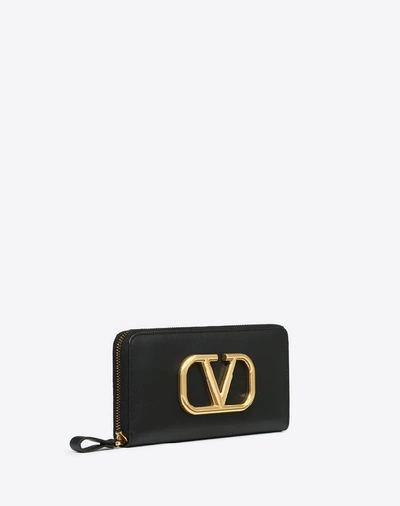 Shop Valentino Garavani Vlogo Calfskin Zippered Wallet In Black