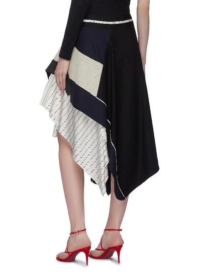 Shop Monse Pinstripe Panel Tiered Asymmetric Patchwork Wool Skirt