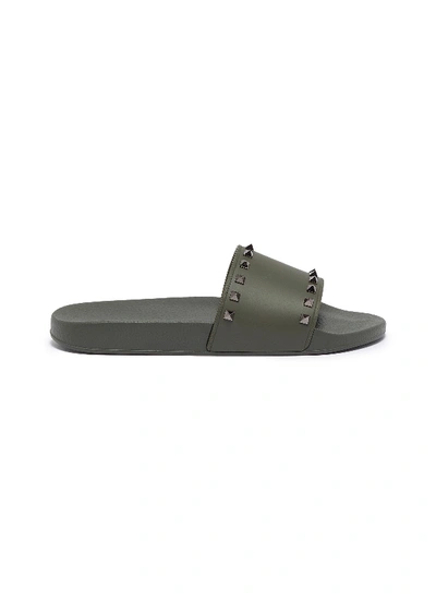 Shop Valentino Garavani Rockstud Slide Sandals In Khaki Green