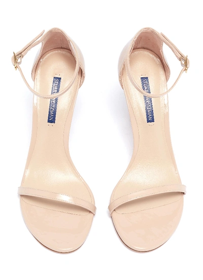 Shop Stuart Weitzman 'nudistsong' Ankle Strap Patent Leather Ankle Strap Sandals In Neutral