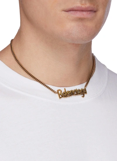 Shop Balenciaga 'typo' Logo Pendant Necklace In Gold