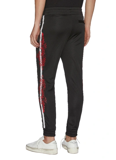 Shop Amiri Dragon Graphic Embroidered Stripe Outseam Jogging Pants