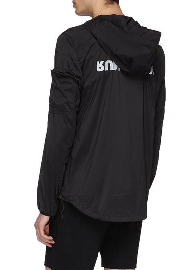 Shop Satisfy 'run Away' Reflective Slogan Print Packable Windbreaker Jacket In Black