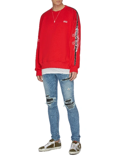 Shop Amiri 'mx1' Pleated Leather Patch Jeans