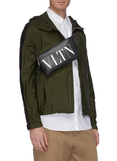 Shop Valentino Logo Print Leather Bum Bag In Black