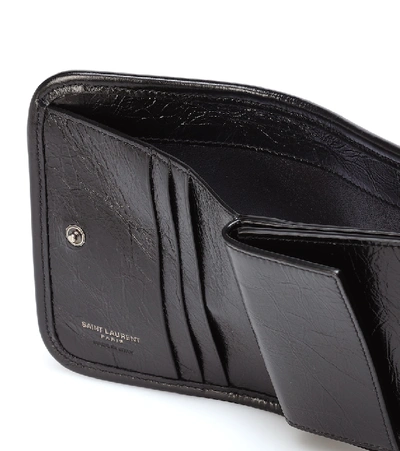 Shop Saint Laurent Niki Leather Wallet In Black