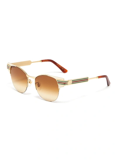 Shop Gucci Web Stripe Temple Metal Round Sunglasses In Metallic