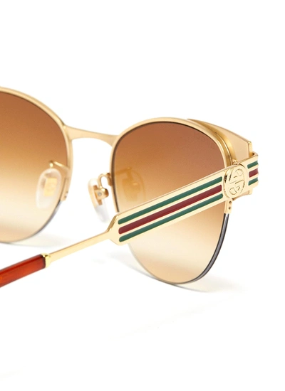 Shop Gucci Web Stripe Temple Metal Round Sunglasses In Metallic