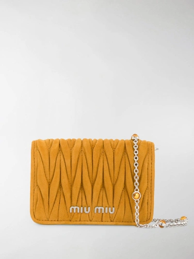 Shop Miu Miu Micro Matelassé Crossbody Bag In Yellow