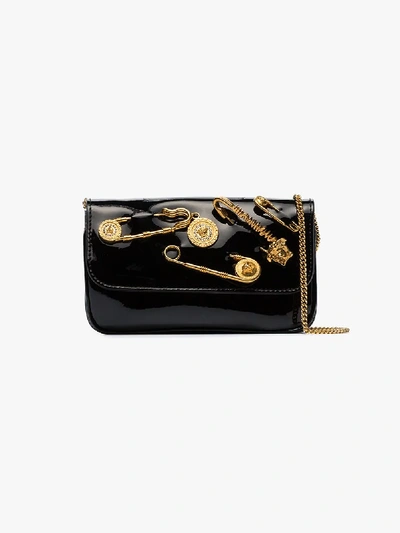 Shop Versace Black Pin Embellished Patent Leather Clutch Bag