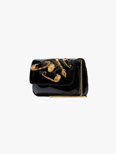 Shop Versace Black Pin Embellished Patent Leather Clutch Bag