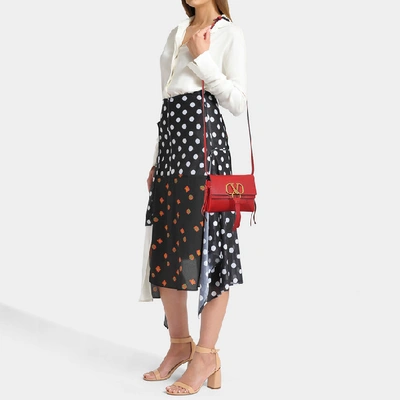 Shop Valentino Garavani | Small Vring Crossbody Bag In Black Calfskin In Red