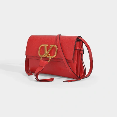 Shop Valentino Garavani | Small Vring Crossbody Bag In Black Calfskin In Red