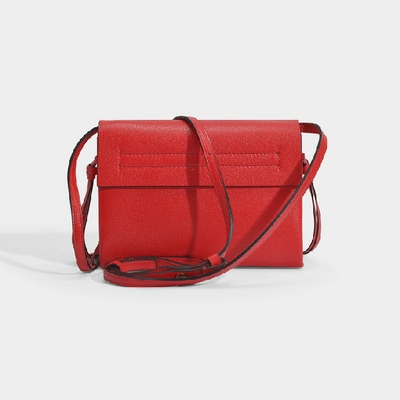 Shop Valentino Garavani | Small Vring Crossbody Bag In Black Calfskin In Red