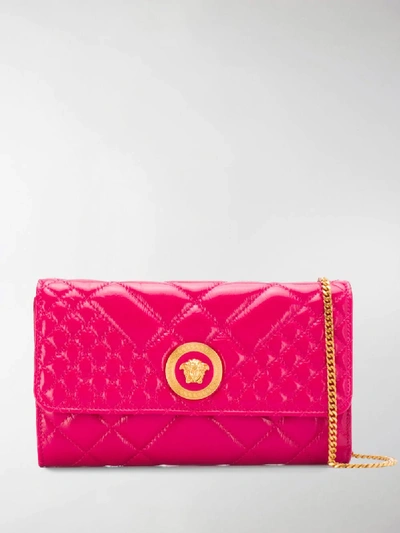 Shop Versace Medusa Head Quilted Clutch In Pink