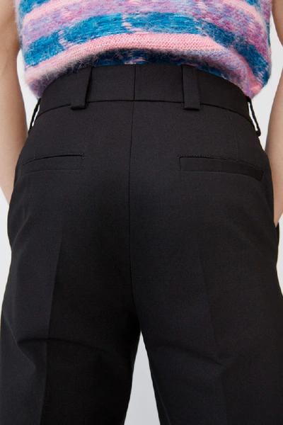 Shop Acne Studios Pleated Trousers Black