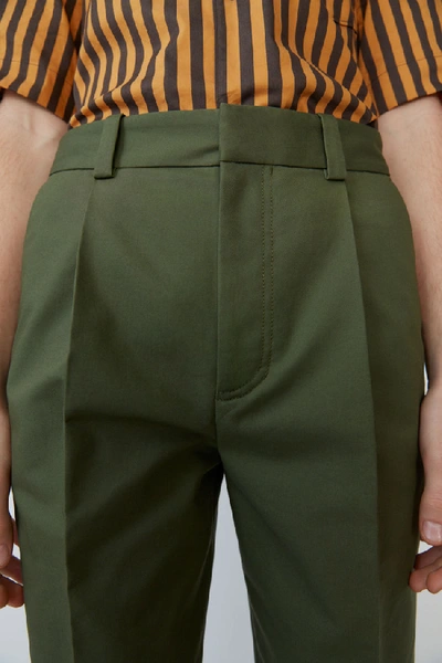 Shop Acne Studios Pleated Trousers Pine Green