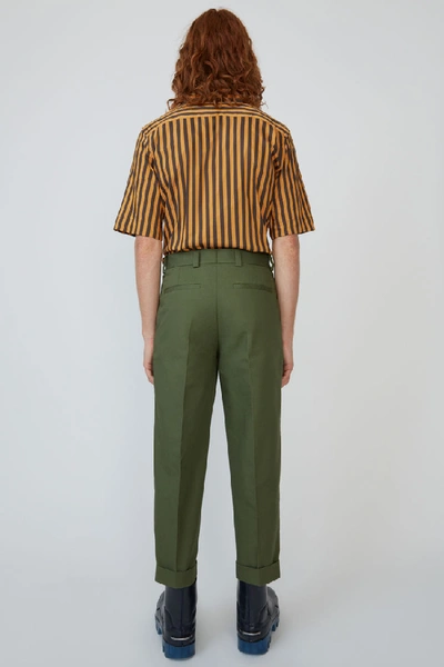Shop Acne Studios Pleated Trousers Pine Green