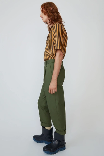 Shop Acne Studios Pleated Trousers Pine Green