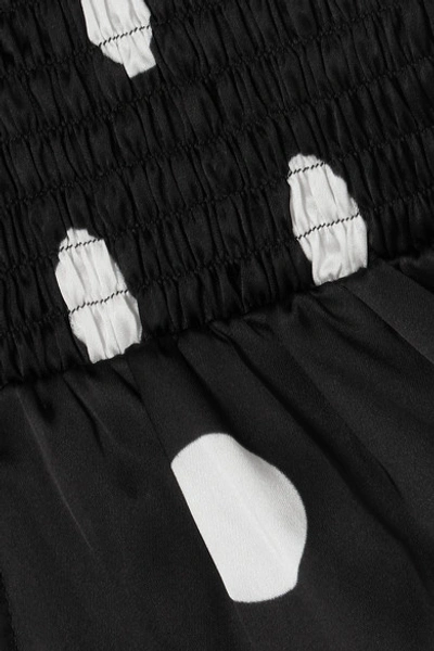 Shop Art Dealer Eva Smocked Wrap-effect Polka-dot Satin Wrap Top In Black