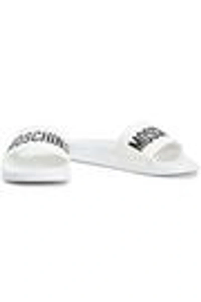 Shop Moschino Embossed Rubber Slides In White