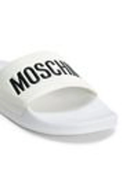 Shop Moschino Embossed Rubber Slides In White