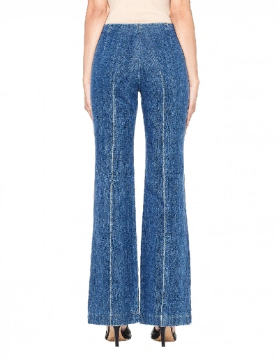 Shop The Row Flared Denim Trousers In Blue