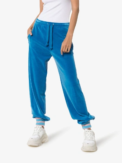 Shop Gucci Tapered Velour Track Pants In Blue