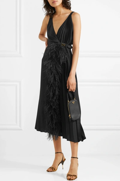 Shop Prada Feather-trimmed Pleated Satin Wrap Dress In Black