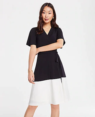 Shop Ann Taylor Petite Colorblock Flutter Sleeve Wrap Dress In Black