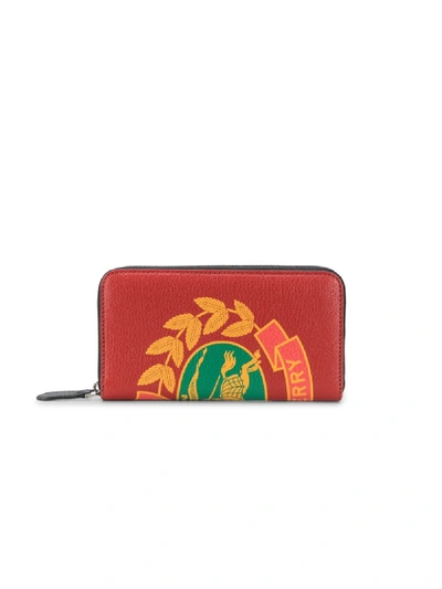 Shop Burberry Crest Print Leather Ziparound Wallet In Red